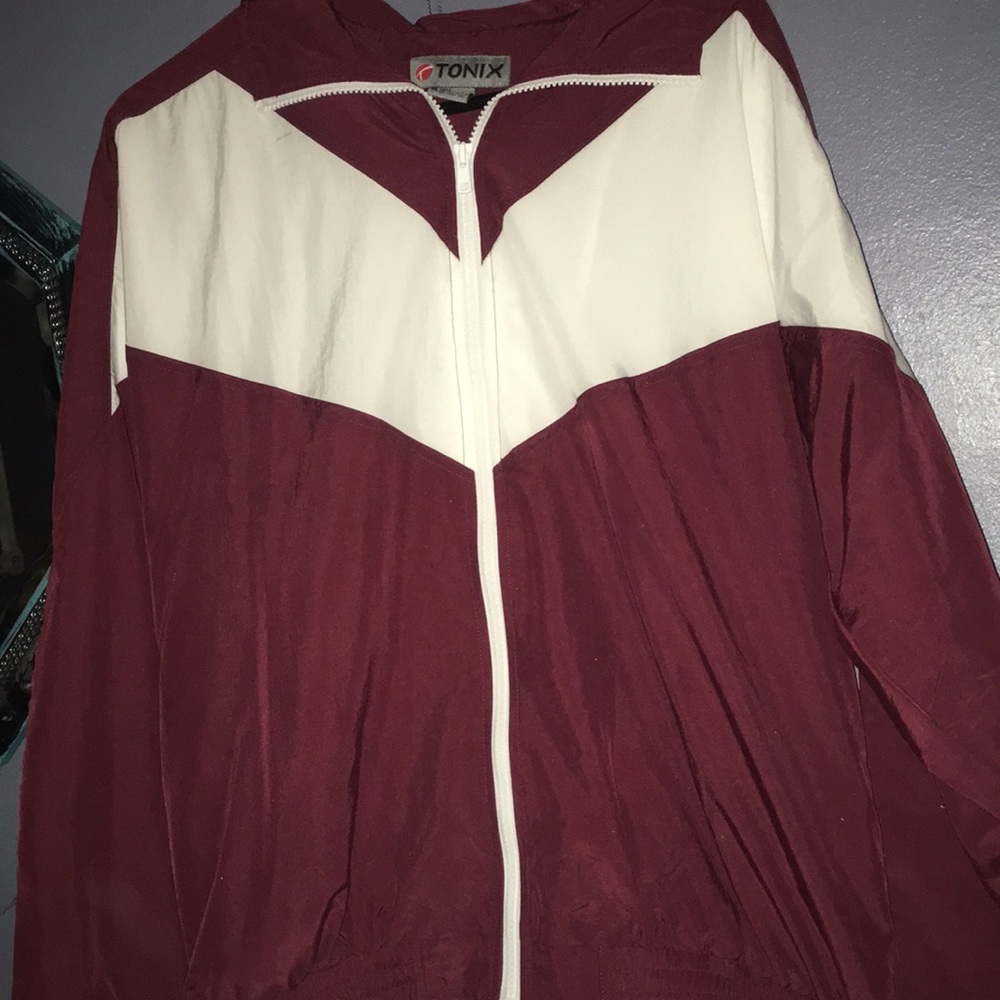 A maroon windbreaker jacket
